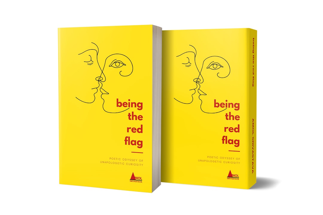 two yellow books with red lettering on them