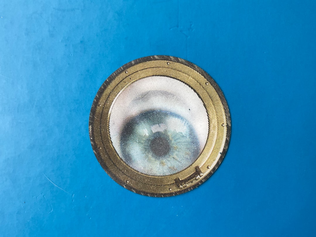 a close up of a metal object on a blue surface