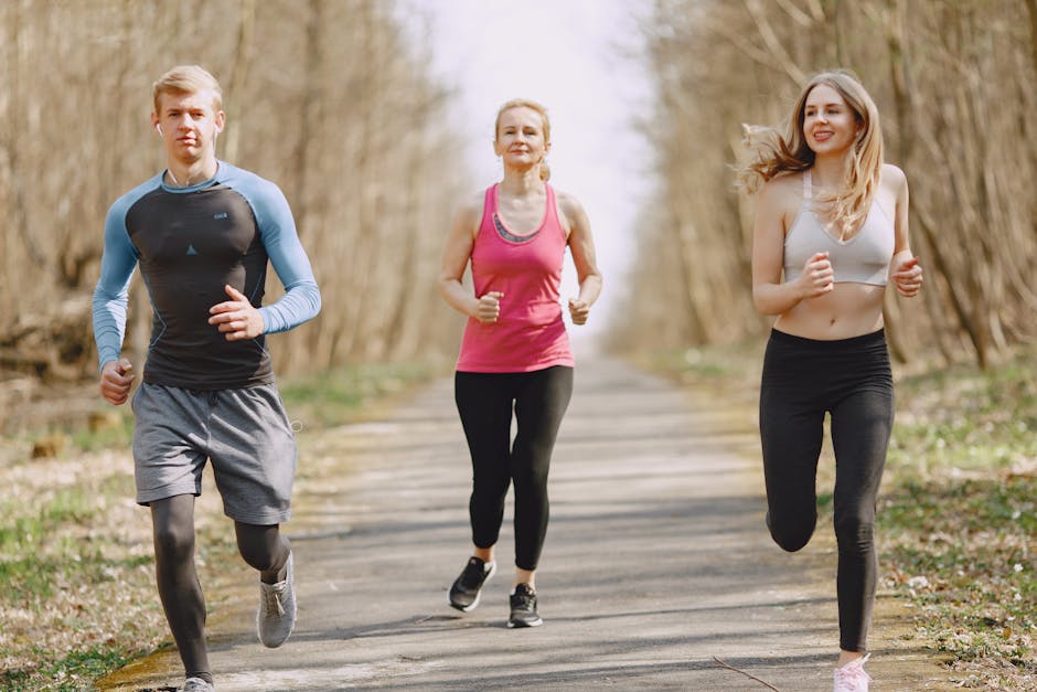 Three adults jogging on a park path, embracing a healthy and active lifestyle.