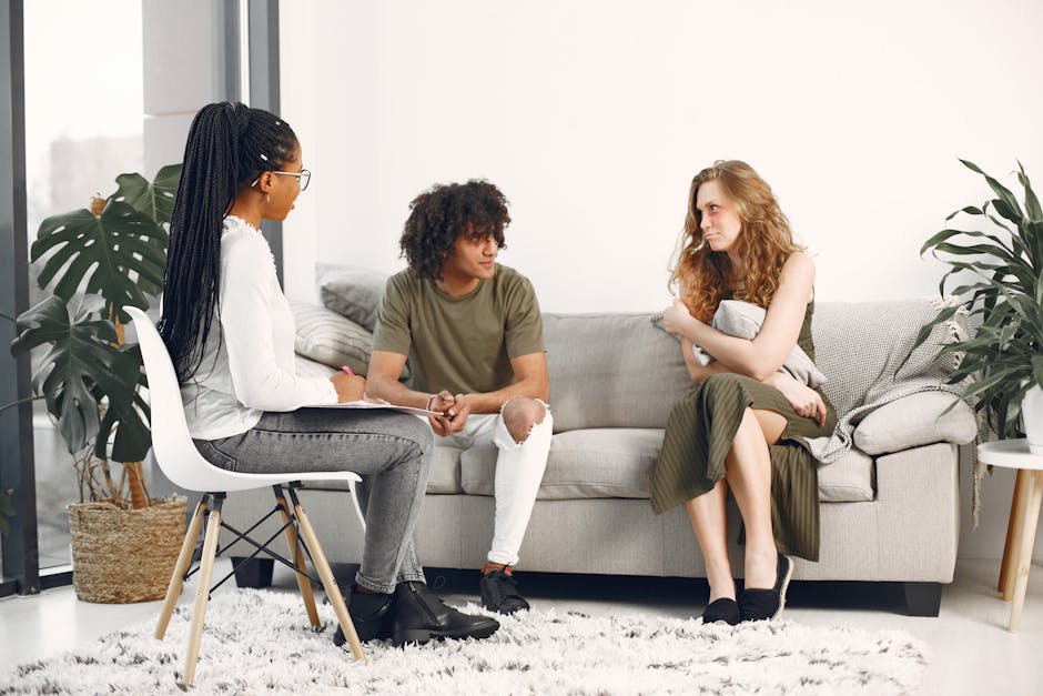 A diverse group engaged in a therapy session in a stylish, modern living room.