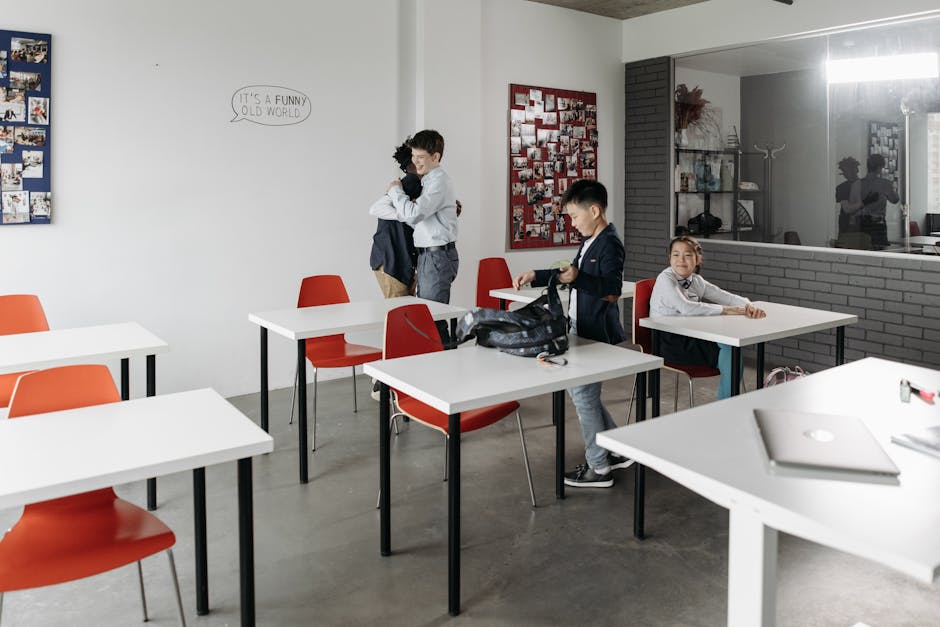 A group of children engaging in a modern classroom, with vibrant decor.
